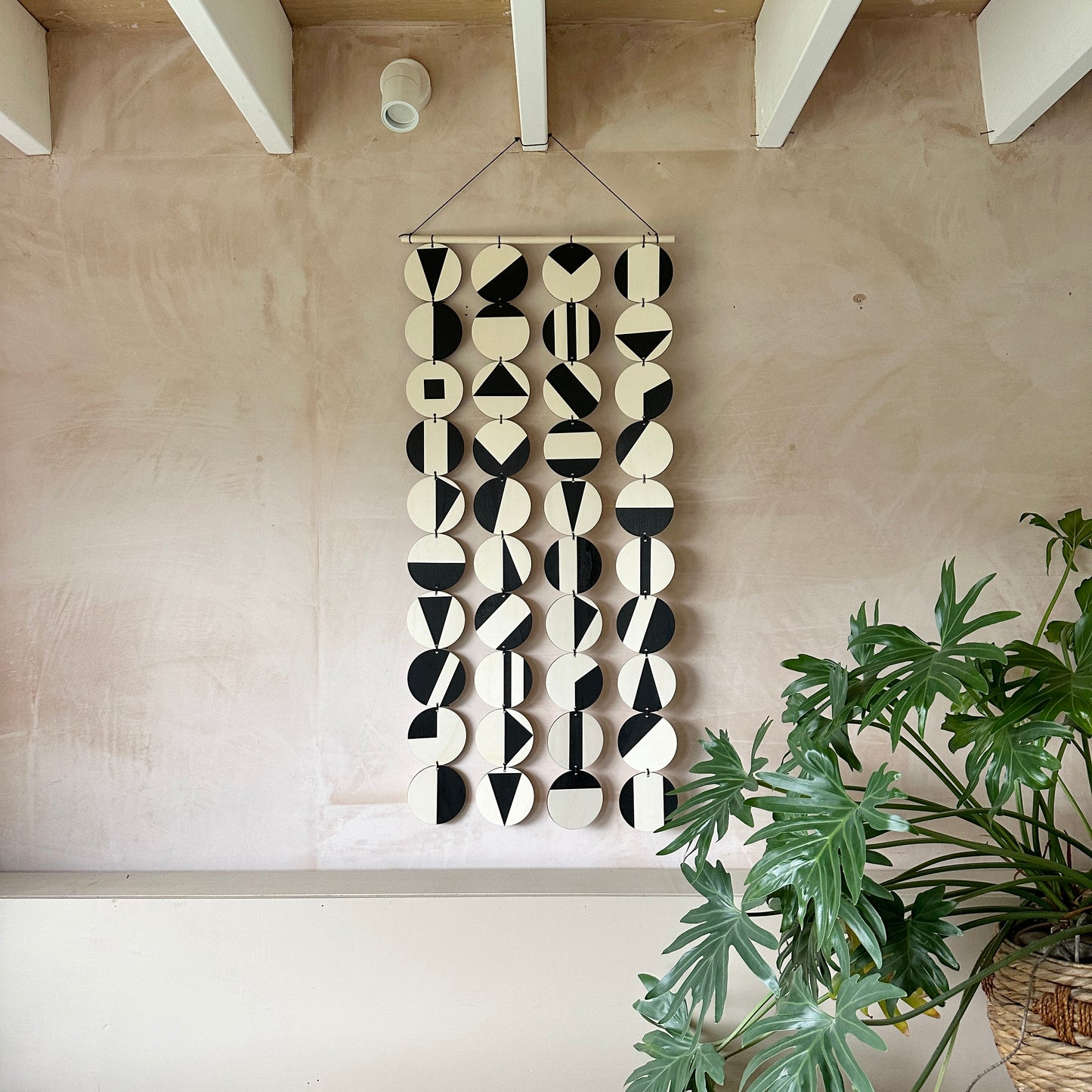 Black Geometric Pattern Wall Hanging - Modern Wall Art - Long Wall Art. Made from 40 discs of plywood measuring 125cm L x 47cm W