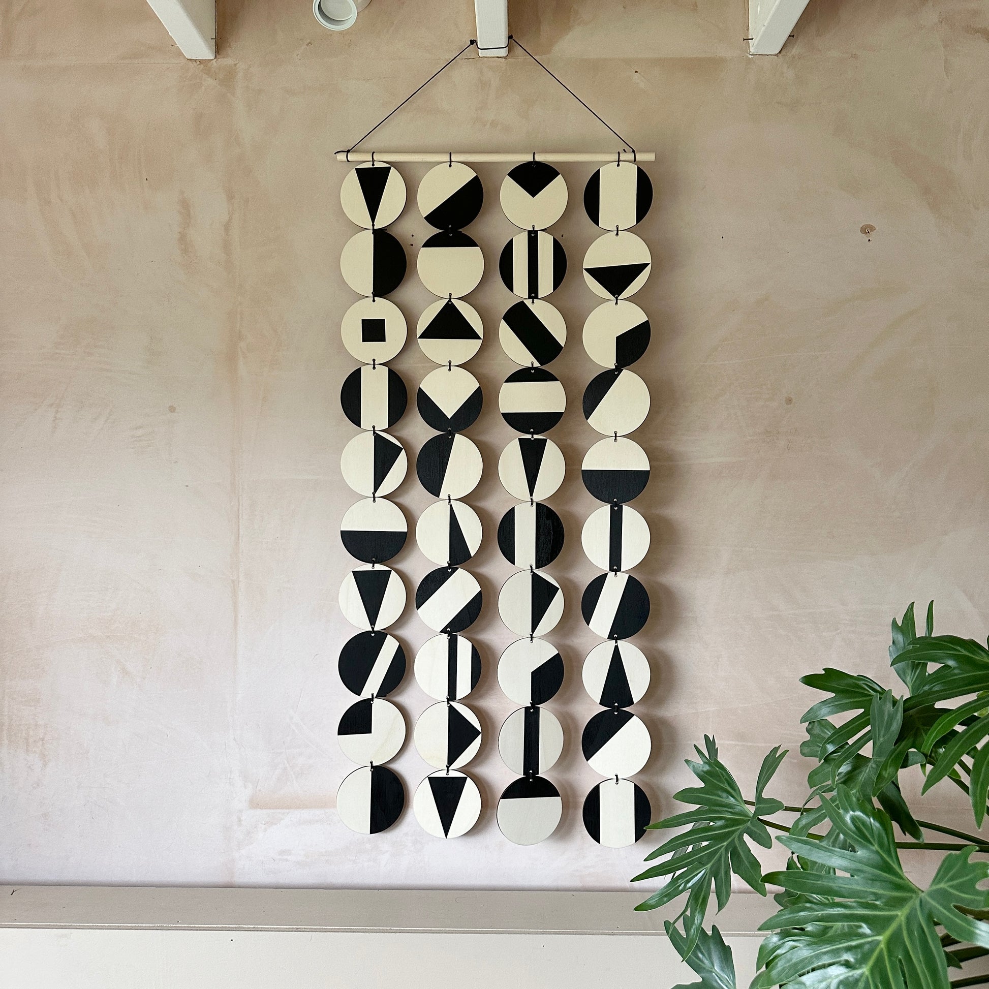 Black Geometric Pattern Wall Hanging - Modern Wall Art - Long Wall Art. Made from 40 discs of plywood measuring 125cm L x 47cm W