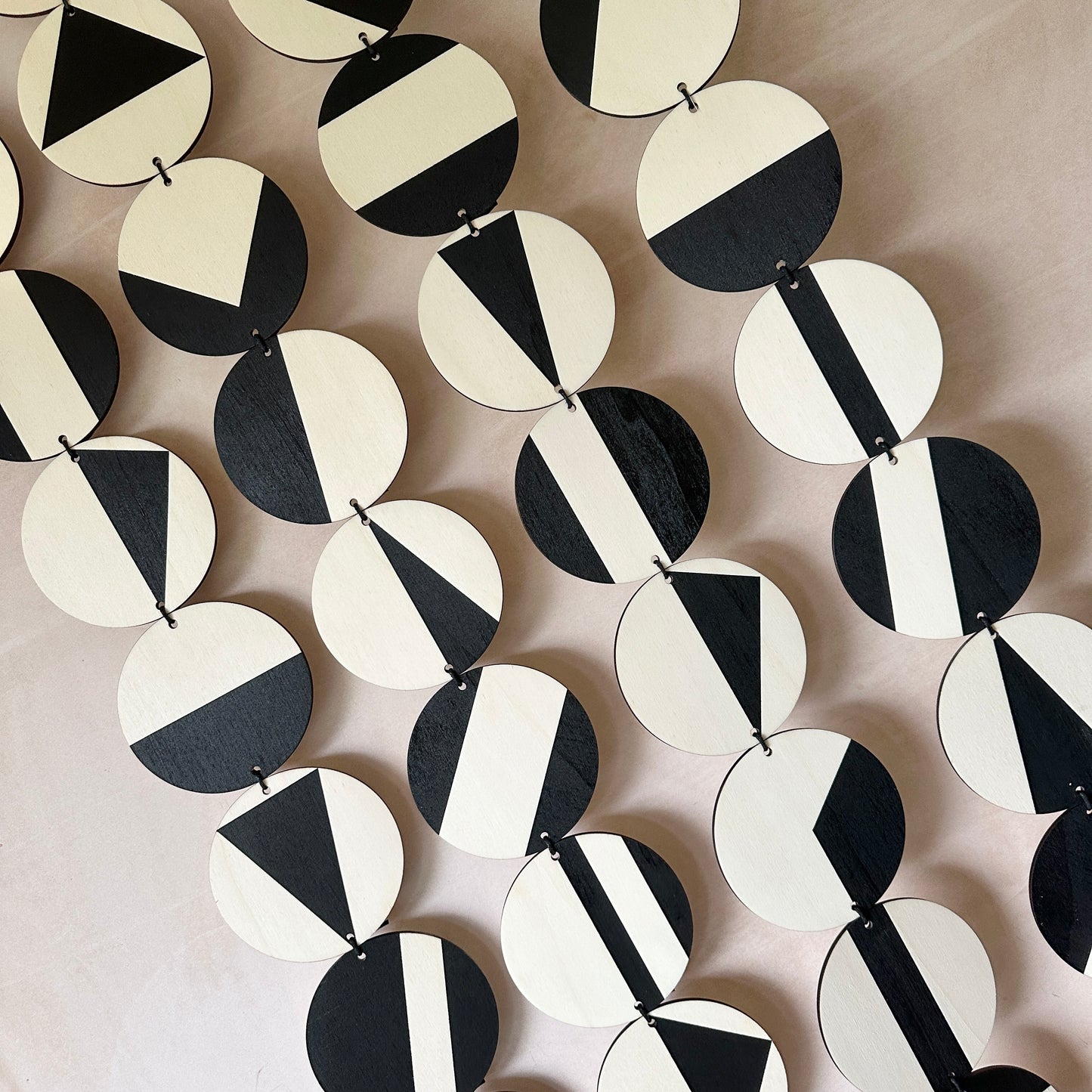 Black Geometric Pattern Wall Hanging - Modern Wall Art - Long Wall Art. Made from 40 discs of plywood measuring 125cm L x 47cm W
