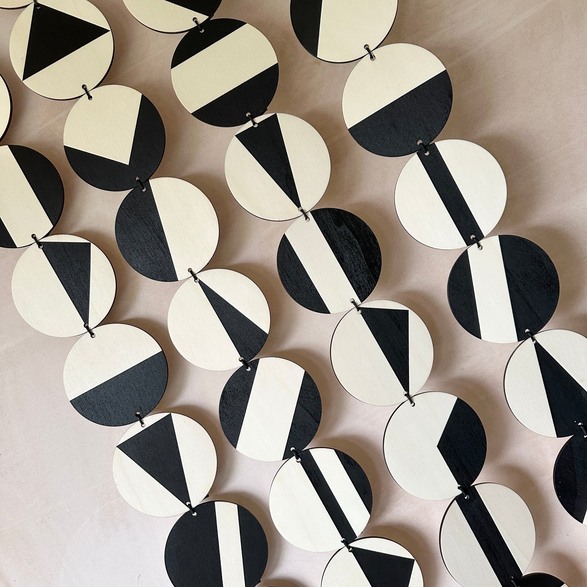 Black Geometric Pattern Wall Hanging - Modern Wall Art - Long Wall Art. Made from 40 discs of plywood measuring 125cm L x 47cm W