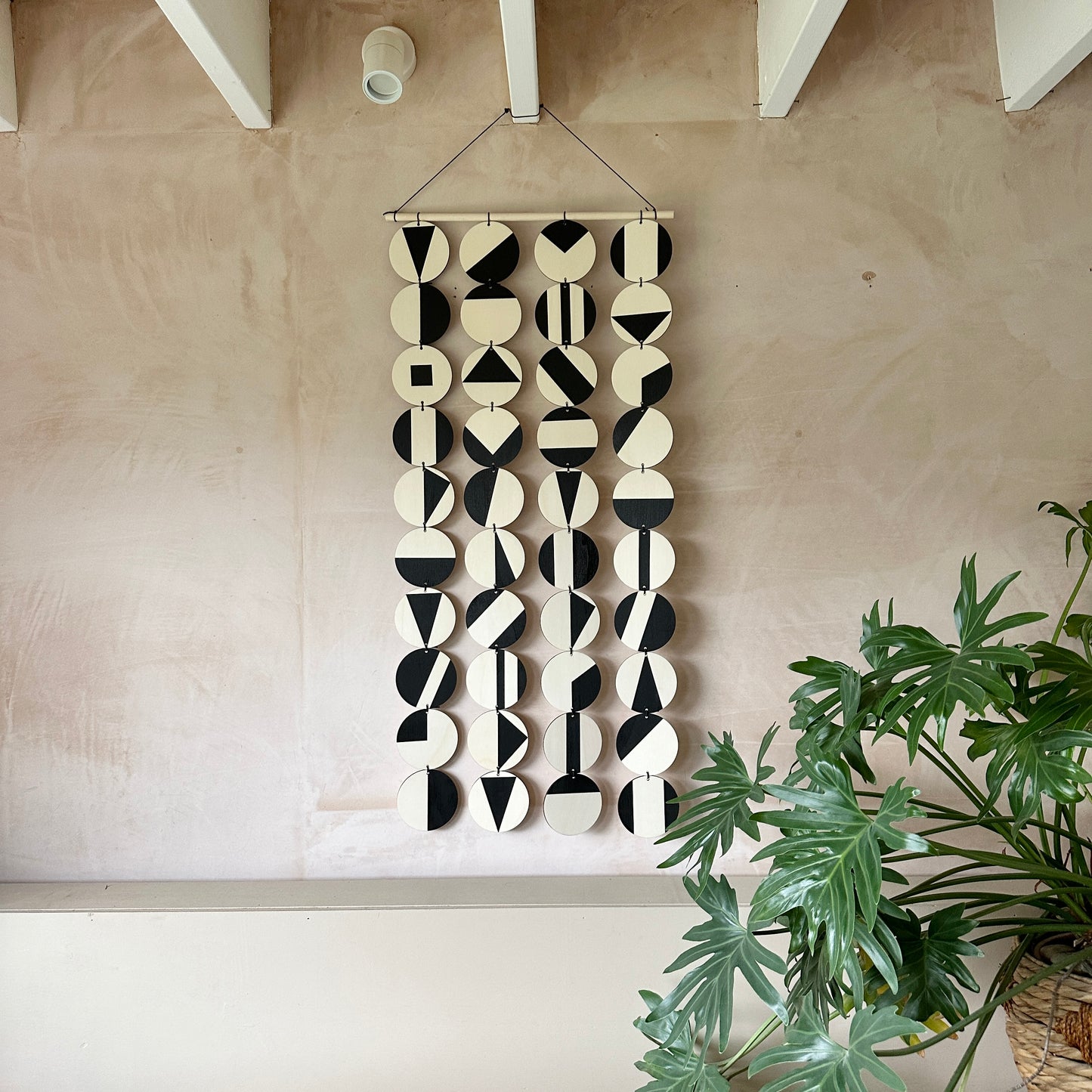 Black Geometric Pattern Wall Hanging - Modern Wall Art - Long Wall Art. Made from 40 discs of plywood measuring 125cm L x 47cm W