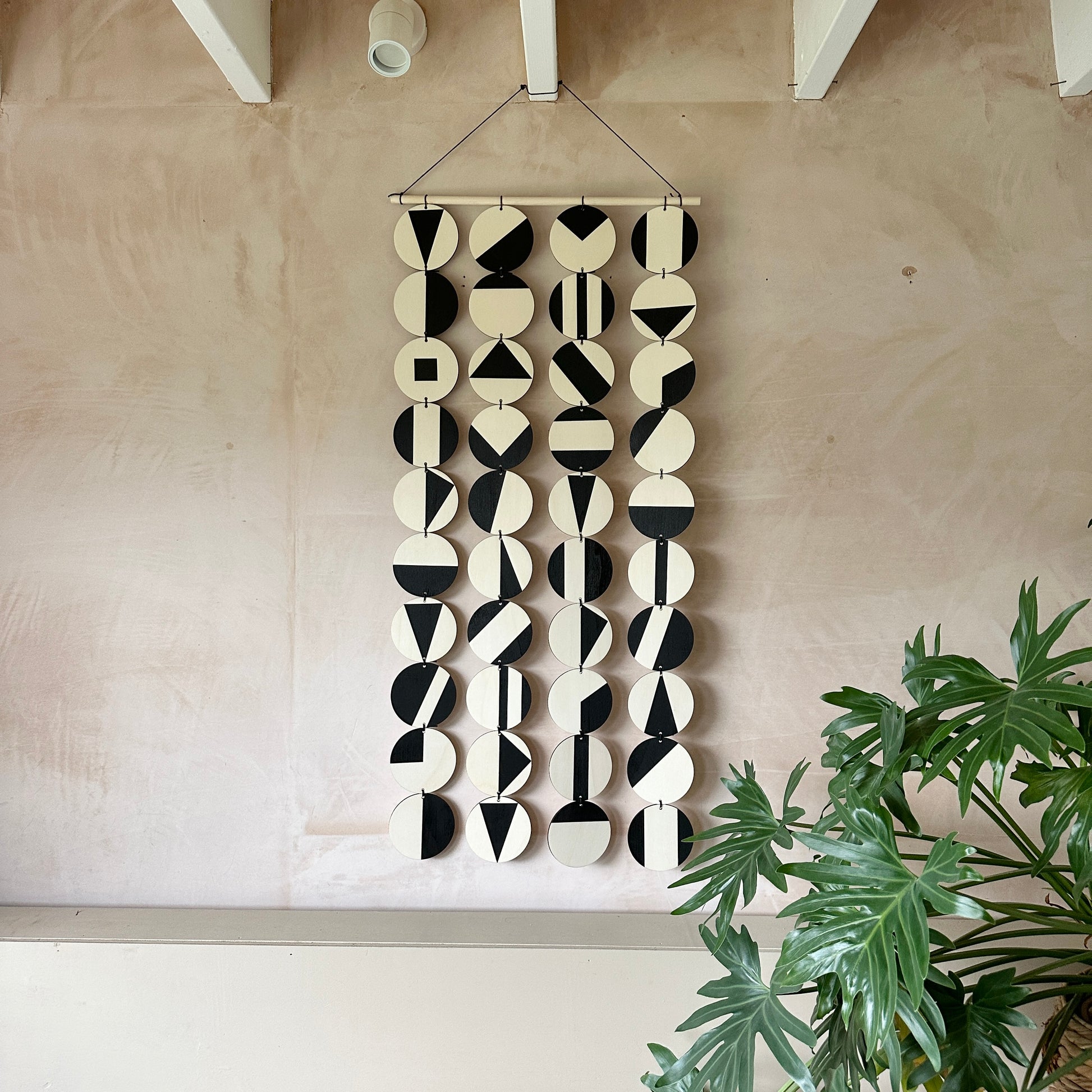 Black Geometric Pattern Wall Hanging - Modern Wall Art - Long Wall Art. Made from 40 discs of plywood measuring 125cm L x 47cm W
