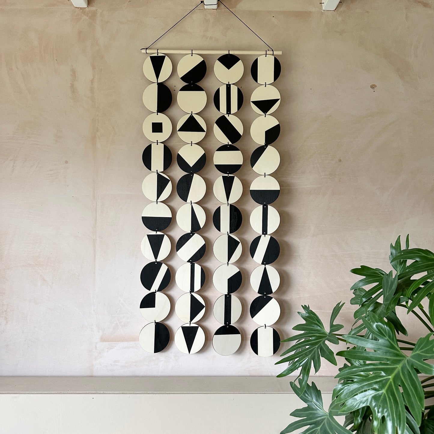 Black Geometric Pattern Wall Hanging - Modern Wall Art - Long Wall Art. Made from 40 discs of plywood measuring 125cm L x 47cm W