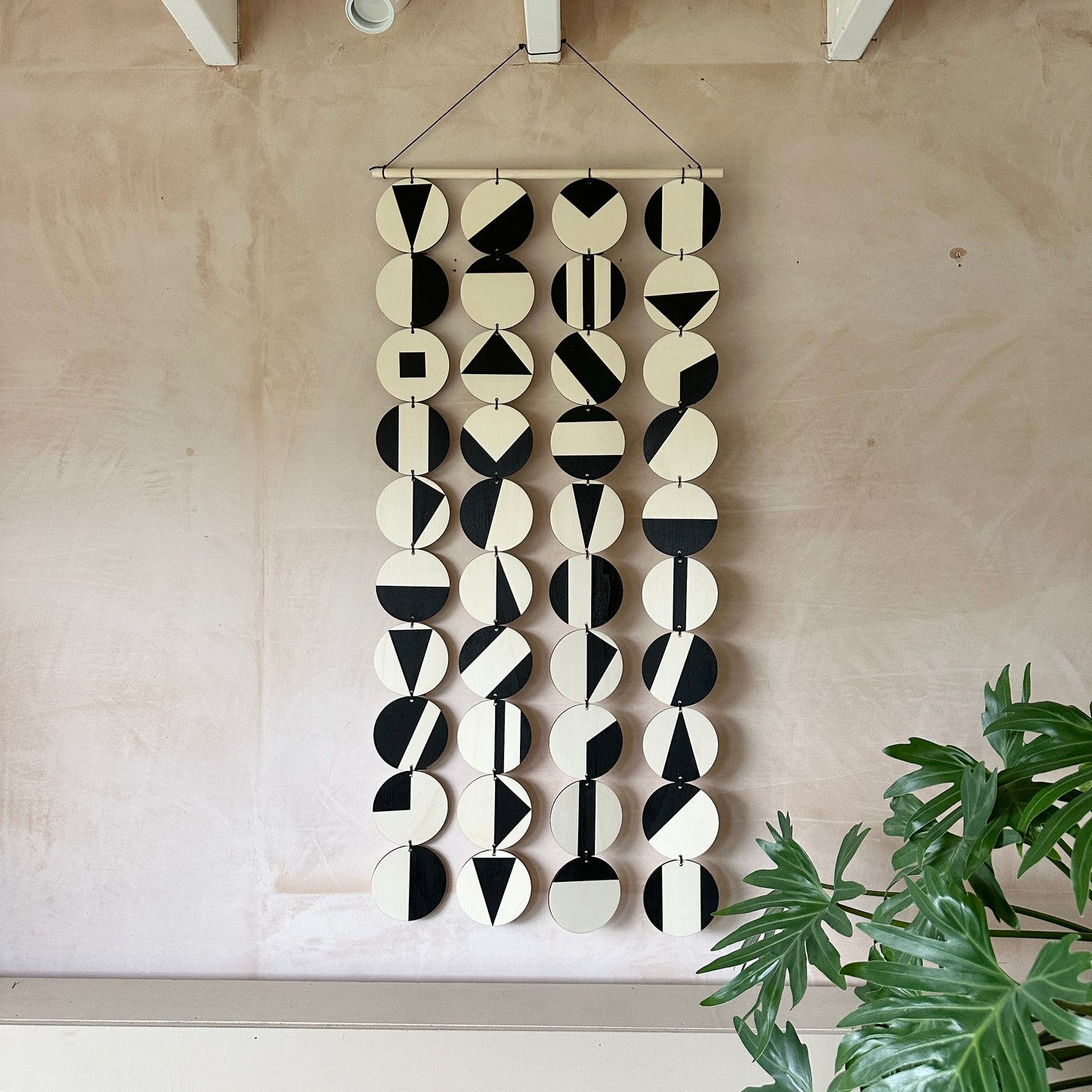 Black Geometric Pattern Wall Hanging - Modern Wall Art - Long Wall Art. Made from 40 discs of plywood measuring 125cm L x 47cm W