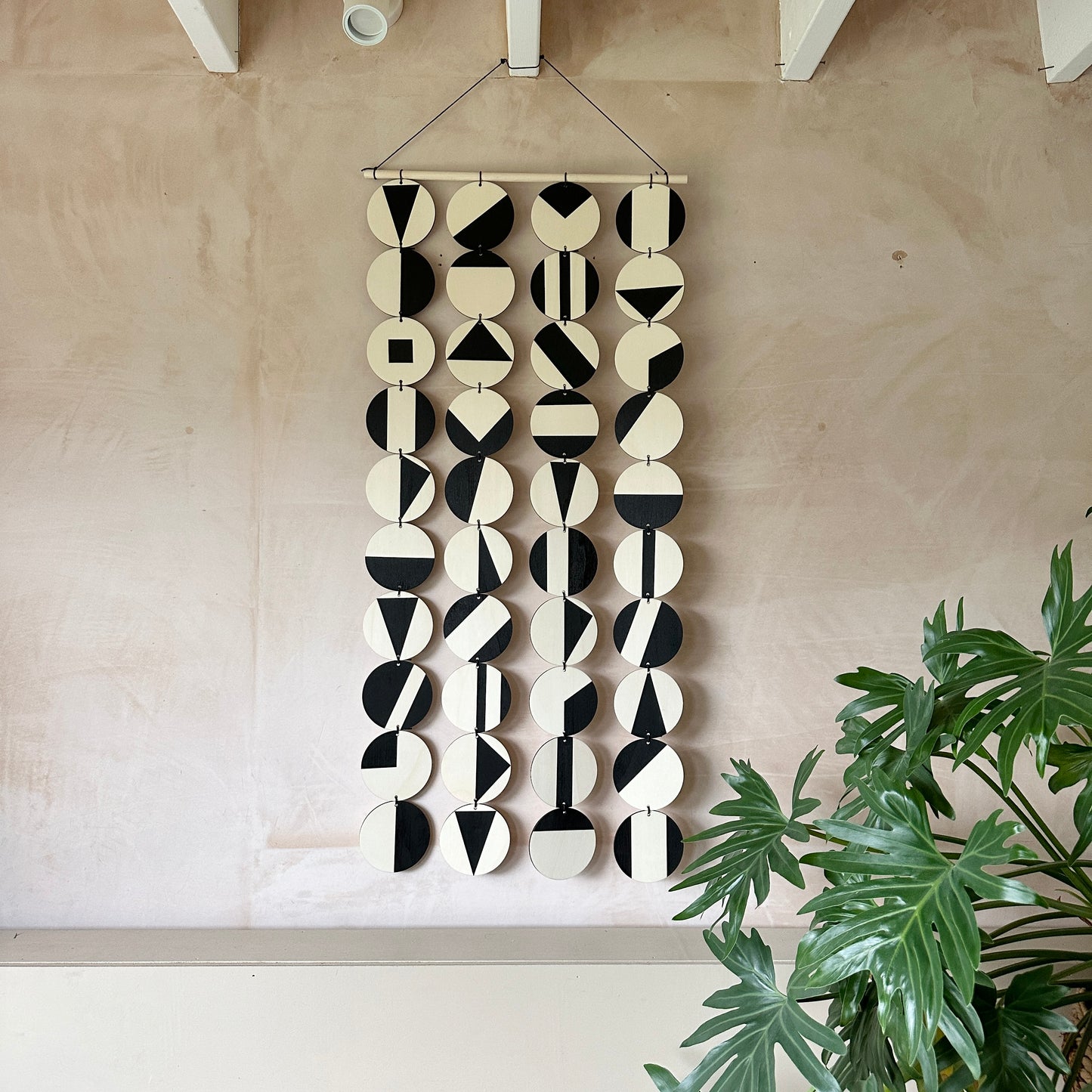 Black Geometric Pattern Wall Hanging - Modern Wall Art - Long Wall Art. Made from 40 discs of plywood measuring 125cm L x 47cm W