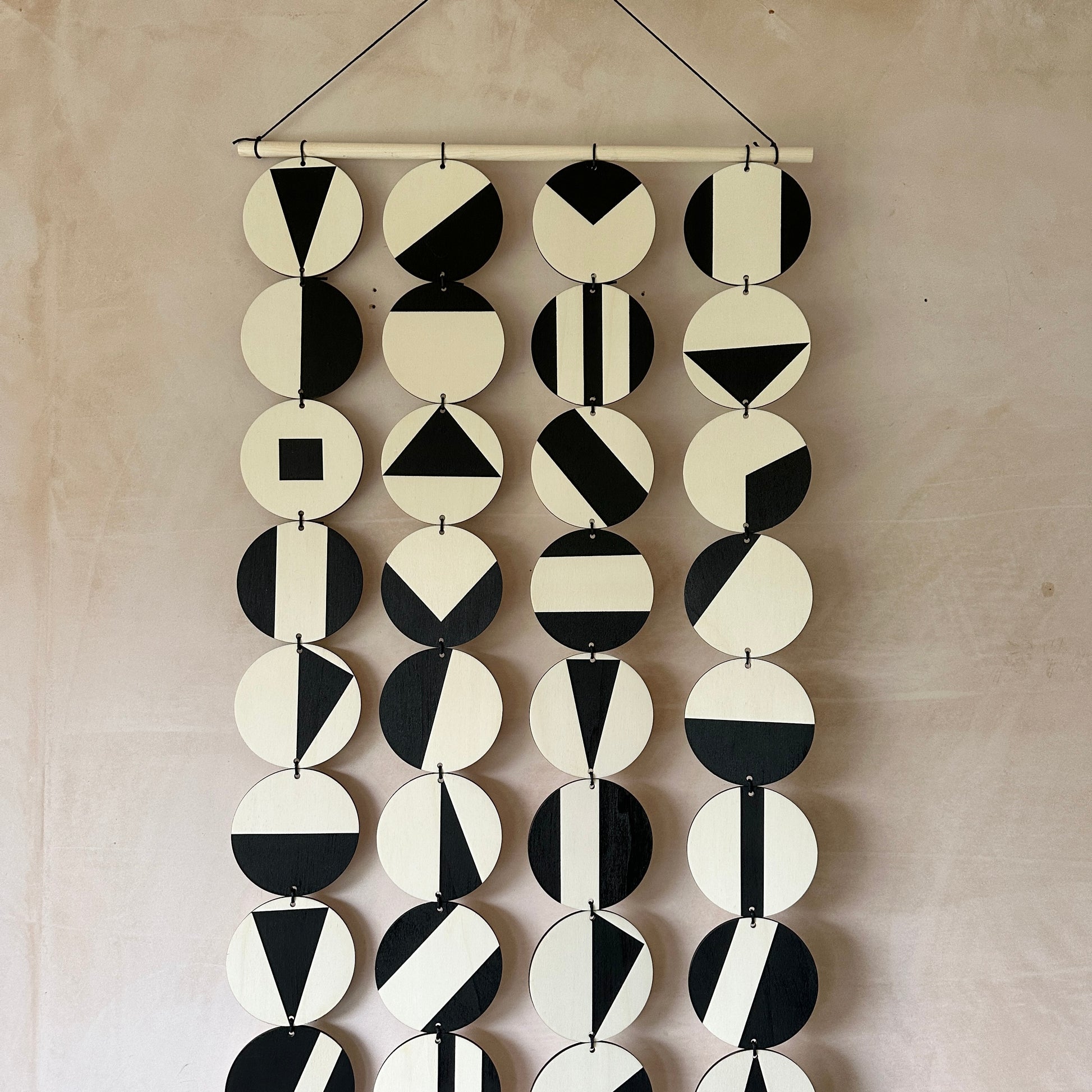 Black Geometric Pattern Wall Hanging - Modern Wall Art - Long Wall Art. Made from 40 discs of plywood measuring 125cm L x 47cm W