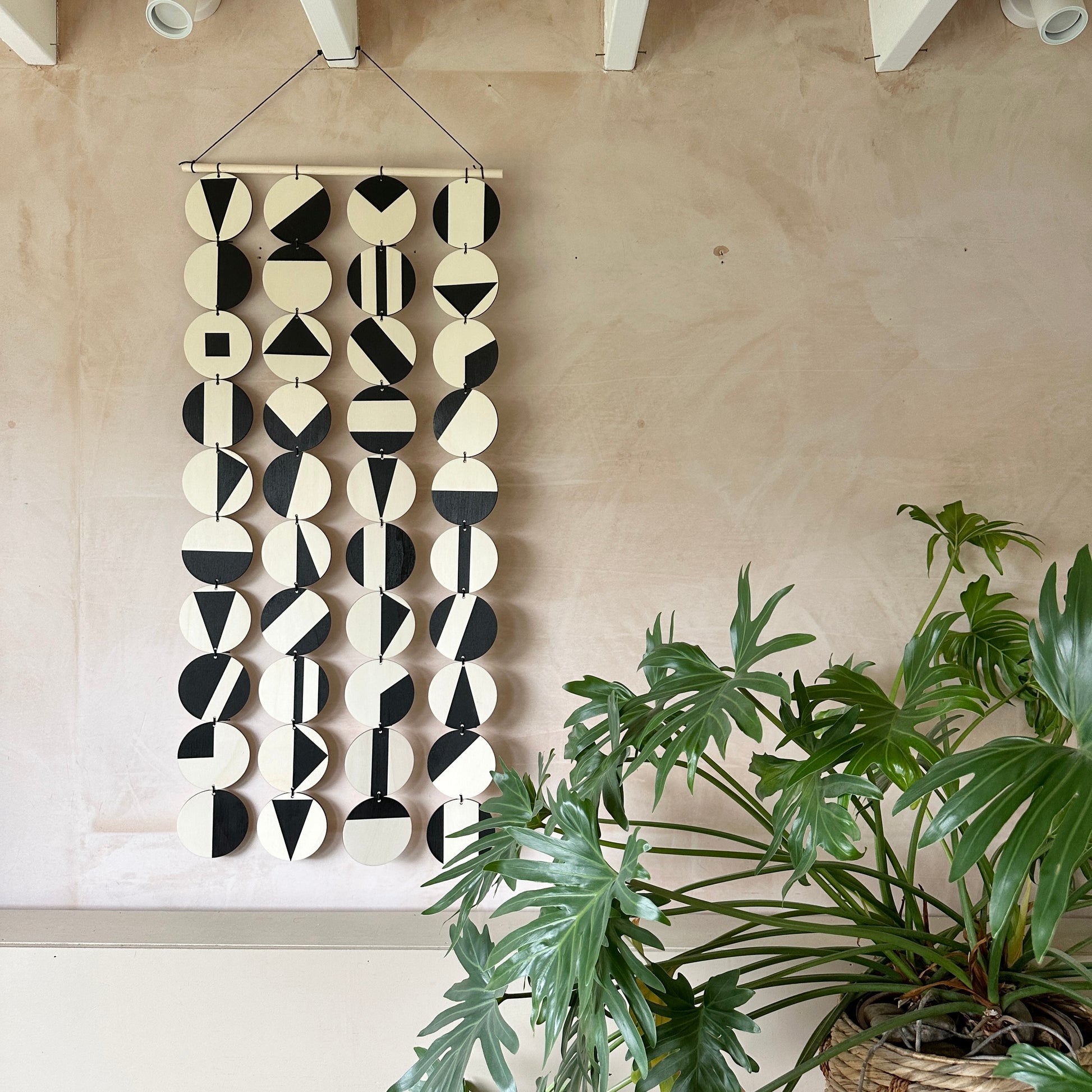 Black Geometric Pattern Wall Hanging - Modern Wall Art - Long Wall Art. Made from 40 discs of plywood measuring 125cm L x 47cm W