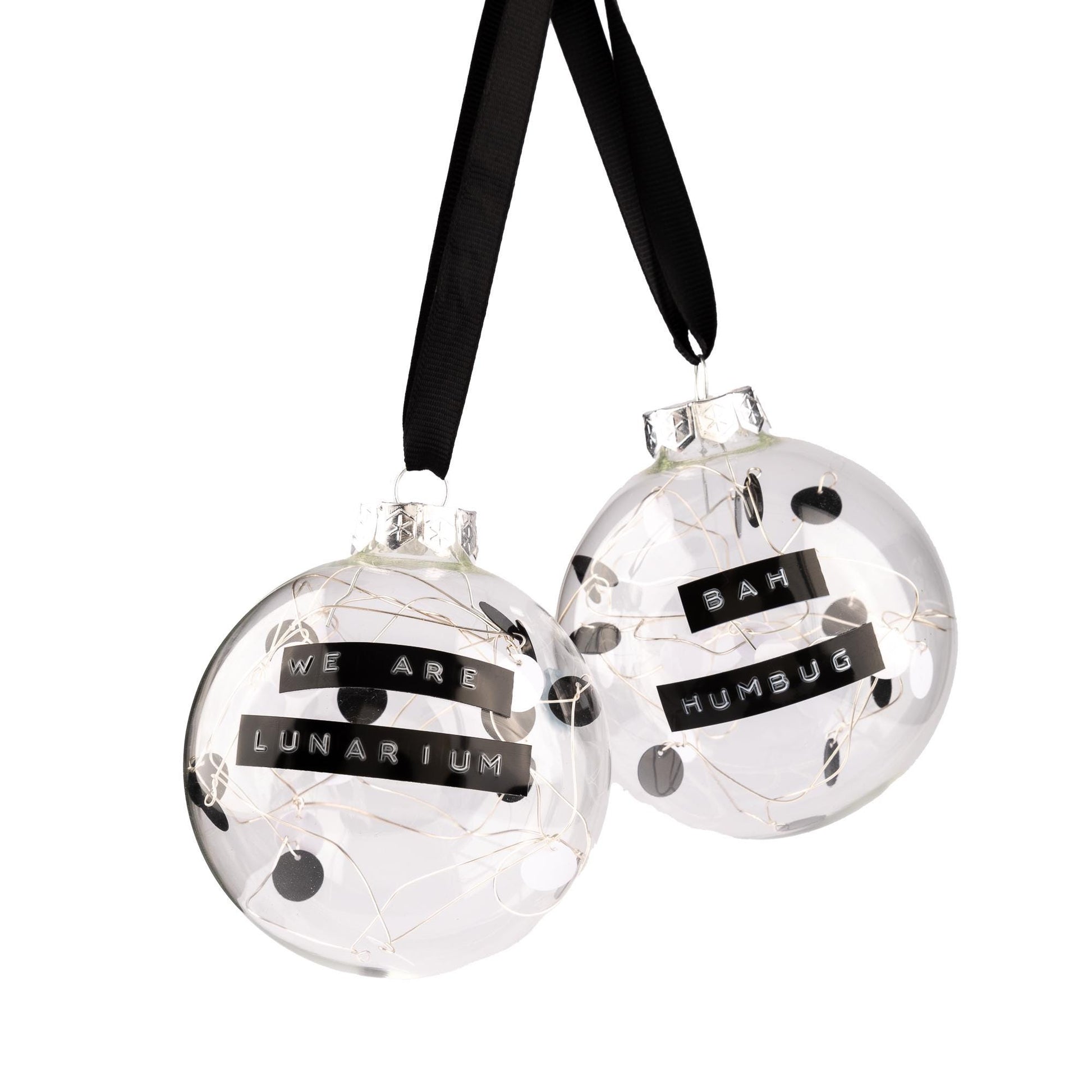 Bauble with a personalised message written on it. The inside has black and white sequins hand tied on silver wire.