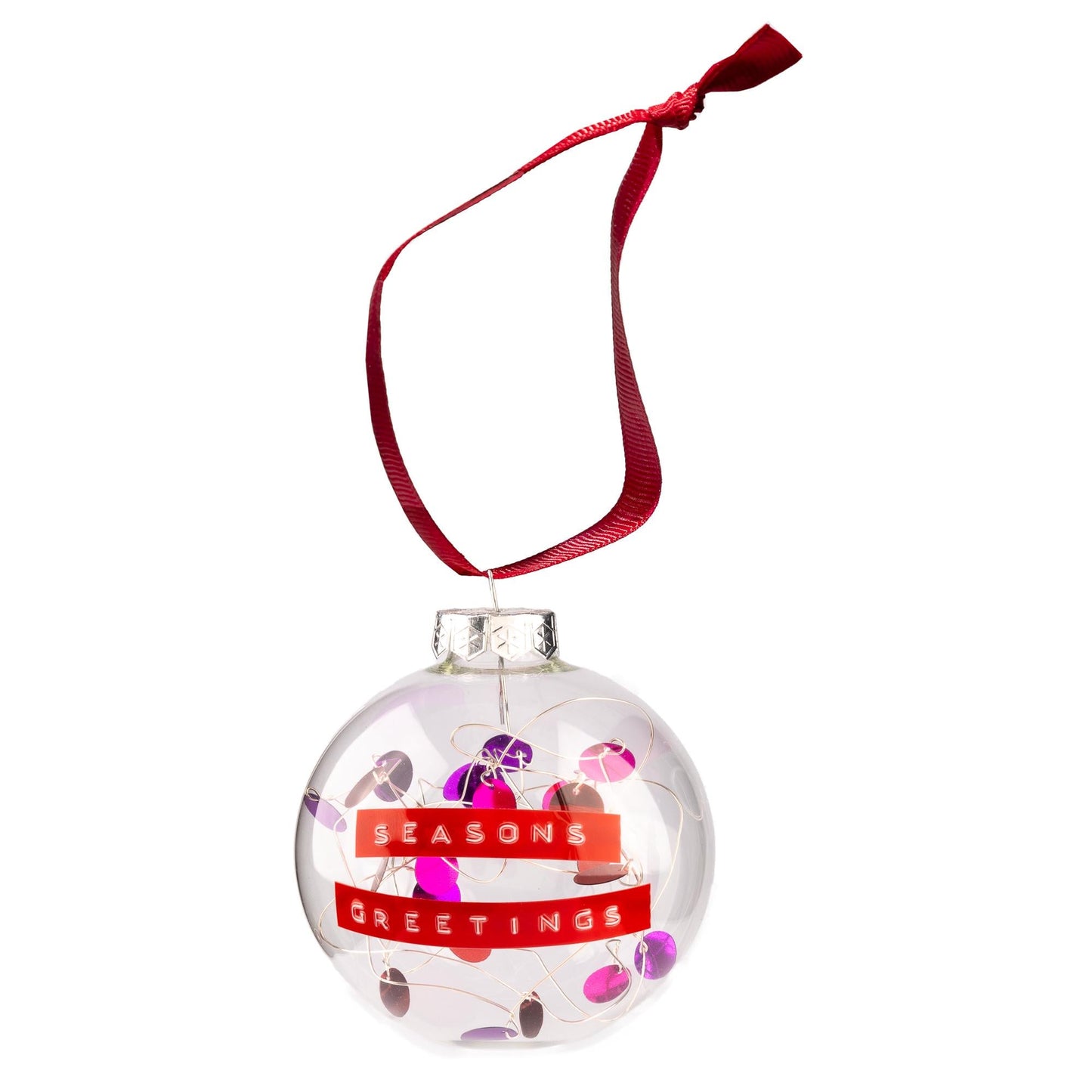 A glass bauble with red and purple sequins on silver wire with a red ribbon to hang it from. With a personalised message written on red tape.